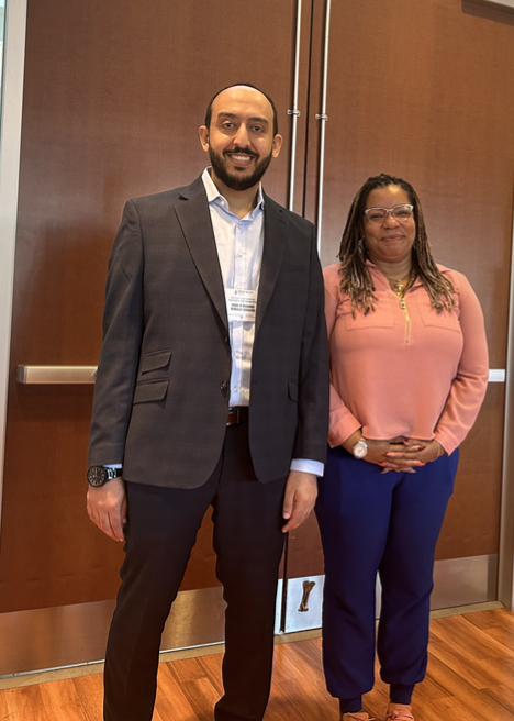 Heider Al Mashalah and Shervaughn Bennett, standing together and smiling.